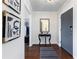 Elegant foyer featuring stylish decor, a decorative table, and sleek hardwood floors, creating a warm ambiance at 215 Piedmont Ne Ave # 1406, Atlanta, GA 30308