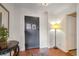 Well lit entryway with dark door, hardwood floors, and decorative table at 215 Piedmont Ne Ave # 1406, Atlanta, GA 30308