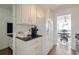 Well-lit kitchen featuring white cabinets, stainless appliances, and stylish modern design at 215 Piedmont Ne Ave # 1406, Atlanta, GA 30308
