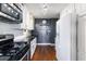 Modern kitchen with stainless steel appliances, white cabinets, and granite countertops at 215 Piedmont Ne Ave # 1406, Atlanta, GA 30308