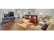 Cozy living room featuring hardwood floors, comfortable seating, and a modern entertainment center at 215 Piedmont Ne Ave # 1406, Atlanta, GA 30308