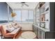Bright sunroom with large windows, city views, and built-in storage and shelving at 215 Piedmont Ne Ave # 1406, Atlanta, GA 30308