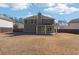 Spacious backyard view of the home from the yard at 7434 Absinth Dr, Atlanta, GA 30349