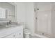 Bathroom with white vanity, toilet, and step-in shower at 7434 Absinth Dr, Atlanta, GA 30349