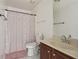 Bathroom featuring a vanity, toilet, and a shower-tub combo with a curtain at 7434 Absinth Dr, Atlanta, GA 30349