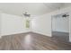 Bedroom with light gray wood-style flooring, a ceiling fan, and natural light at 7434 Absinth Dr, Atlanta, GA 30349