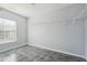 Walk-in closet features gray tile flooring and wire shelving at 7434 Absinth Dr, Atlanta, GA 30349