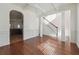 Open dining area with hardwood floors, decorative ceiling beams and a modern chandelier at 7434 Absinth Dr, Atlanta, GA 30349