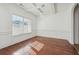 Bright dining room featuring hardwood floors, decorative molding and a large window at 7434 Absinth Dr, Atlanta, GA 30349