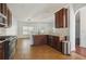 Spacious kitchen with dark cabinets, granite countertops, and stainless steel appliances at 7434 Absinth Dr, Atlanta, GA 30349