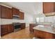 Well-equipped kitchen featuring granite countertops, stainless steel appliances and tile flooring at 7434 Absinth Dr, Atlanta, GA 30349