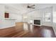 Open floorplan featuring a modern fireplace, hard wood floors, and natural light at 7434 Absinth Dr, Atlanta, GA 30349