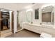 Spacious bathroom with double sink vanity, walk-in shower, and access to walk-in closet at 1045 Shepherds Ne Ln, Atlanta, GA 30324