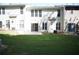 Townhome backyard featuring a grass lawn and a patio area at 2426 Fairlie Dr, Duluth, GA 30096