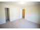 Open bedroom layout with carpeting and access to closets at 2426 Fairlie Dr, Duluth, GA 30096