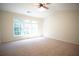 Bright, spacious bedroom with large windows and plush carpeting perfect for relaxation at 2426 Fairlie Dr, Duluth, GA 30096