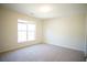 Bright bedroom with a large window and plush carpeting at 2426 Fairlie Dr, Duluth, GA 30096