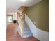 Inviting foyer featuring hardwood floors and carpeted stairs to upper level at 2426 Fairlie Dr, Duluth, GA 30096