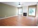 Spacious living room with fireplace and natural light from large windows at 2426 Fairlie Dr, Duluth, GA 30096