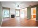 Bright living room features a fireplace, hardwood floors, and access to the kitchen at 2426 Fairlie Dr, Duluth, GA 30096