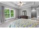Neutral bedroom with large window, blinds, and ceiling fan at 1912 Hosea L Williams Ne Dr # 1, Atlanta, GA 30317