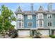 Charming townhome featuring bay windows, a two-car garage, and inviting curb appeal at 1912 Hosea L Williams Ne Dr # 1, Atlanta, GA 30317