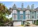 Charming townhome with bay windows, front-entry garages, and colorful, vibrant exterior at 1912 Hosea L Williams Ne Dr # 1, Atlanta, GA 30317
