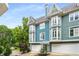 Stylish townhome featuring bay windows, a two-car garage, and inviting curb appeal at 1912 Hosea L Williams Ne Dr # 1, Atlanta, GA 30317
