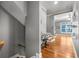 Hallway with hardwood floors leading to living room, stairs, and home office at 1912 Hosea L Williams Ne Dr # 1, Atlanta, GA 30317
