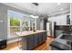 Bright kitchen with large island, stainless appliances, and hardwood floors at 1912 Hosea L Williams Ne Dr # 1, Atlanta, GA 30317