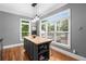 Butcher block kitchen island with custom cabinets, plenty of natural light, and hardwood floors at 1912 Hosea L Williams Ne Dr # 1, Atlanta, GA 30317