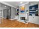 Stylish living room featuring fireplace, built-in shelving, and hardwood floors at 1912 Hosea L Williams Ne Dr # 1, Atlanta, GA 30317