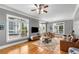 Cozy living room featuring hardwood floors, many windows, and comfortable seating at 1912 Hosea L Williams Ne Dr # 1, Atlanta, GA 30317