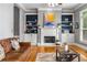 Inviting living room featuring a fireplace, built-in bookshelves, and hardwood floors at 1912 Hosea L Williams Ne Dr # 1, Atlanta, GA 30317