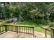 Inviting backyard features a wooden deck overlooking a grass lawn at 272 Creek Sw Ct, Marietta, GA 30064