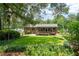 View of brick home's manicured lawn and wooden deck, ideal for entertaining at 272 Creek Sw Ct, Marietta, GA 30064