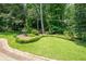 Well-maintained lawn bordered by lush greenery creating a serene outdoor space at 272 Creek Sw Ct, Marietta, GA 30064