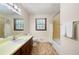 Cozy bathroom featuring a vanity, mirror, and shower-tub combination at 272 Creek Sw Ct, Marietta, GA 30064