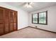 Neutral bedroom featuring carpet, and a large window allowing natural light at 272 Creek Sw Ct, Marietta, GA 30064