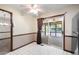 Eat-in kitchen with sliding door to sunroom features neutral paint, ceiling fan, and neutral flooring at 272 Creek Sw Ct, Marietta, GA 30064