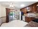 Traditional kitchen featuring tile floors, stainless steel appliances, and sliding door to sunroom at 272 Creek Sw Ct, Marietta, GA 30064