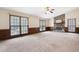 Spacious living room with large windows and a cozy fireplace at 272 Creek Sw Ct, Marietta, GA 30064