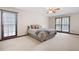 Large main bedroom features neutral carpet, large windows, and neutral paint at 272 Creek Sw Ct, Marietta, GA 30064