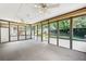 Light-filled sunroom with lots of windows overlooking the backyard at 272 Creek Sw Ct, Marietta, GA 30064