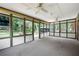 Spacious sunroom surrounded by windows, offering serene backyard views at 272 Creek Sw Ct, Marietta, GA 30064