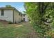 Exterior elevation of home's backyard with lush green grass at 3422 Maplehurst Dr, Decatur, GA 30032