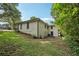 Exterior elevation of home's backyard with lush green grass at 3422 Maplehurst Dr, Decatur, GA 30032