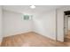 Finished basement space featuring hardwood floors, bright lighting, and a window for natural light at 3422 Maplehurst Dr, Decatur, GA 30032