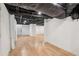Large unfinished basement with wooden floors at 3422 Maplehurst Dr, Decatur, GA 30032