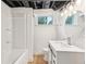 Modern renovated bathroom with new tile and lighting at 3422 Maplehurst Dr, Decatur, GA 30032